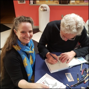 Amber Love getting books signed (and doodled) by Patrick McDonnell