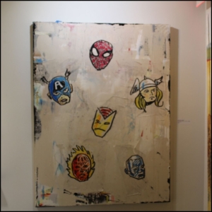 McDonnell's painting showing the layers of paintings underneath. The top layer shows floating heads of Spider-Man, Thor, Captain America, Iron Man, the Human Torch, and Silver Surfer