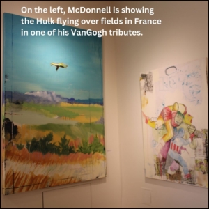 In a corner on the left wall, McDonnell is showing the Hulk flying over fields in France in one of his tributes to Vincent VanGogh; on the right wall shows Marvel heroes fighting each other over layers of collages.